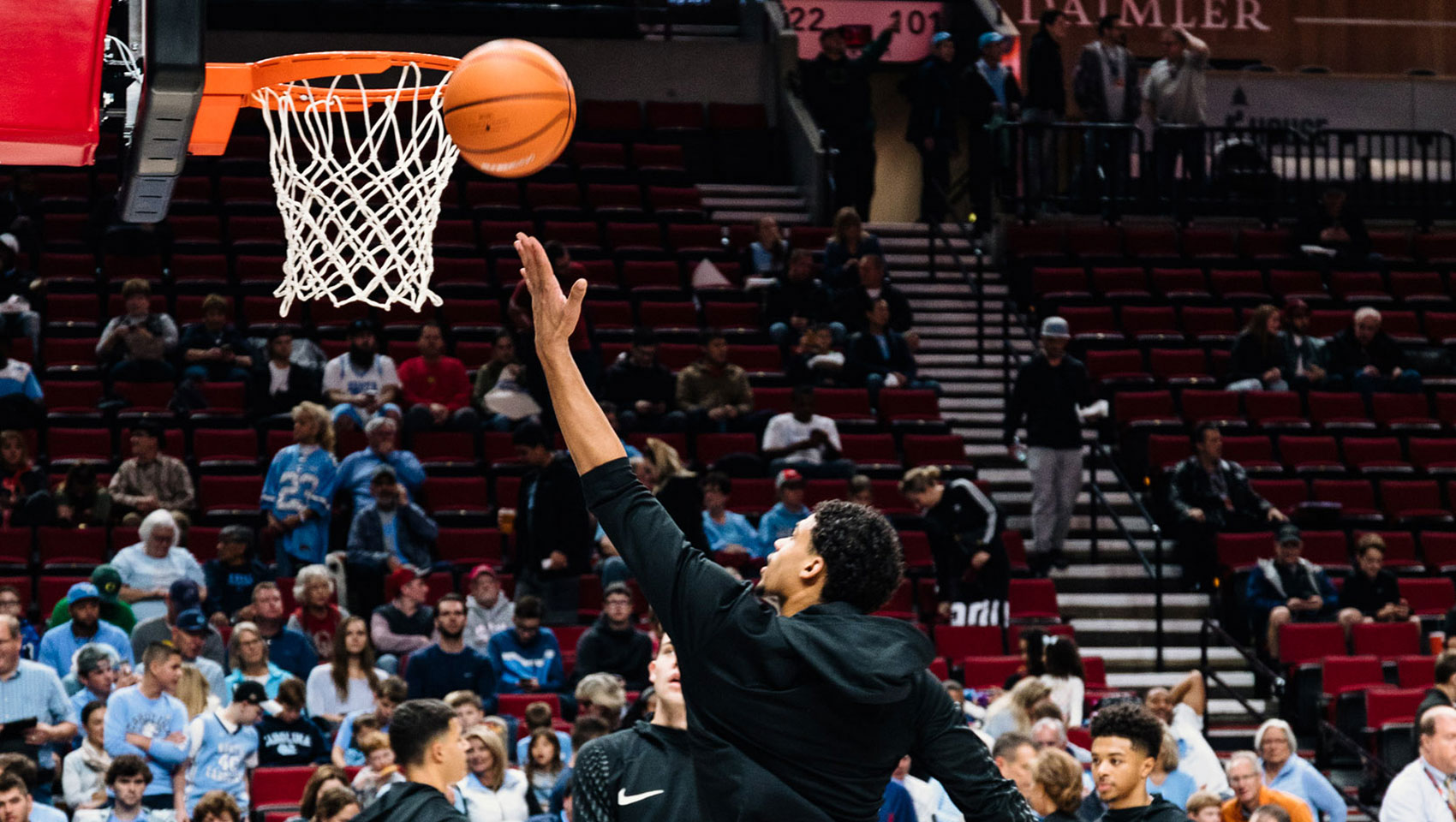 David Alvarado, Travel Portland - Basketball players on the court under the basketball net